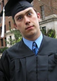 Jeff in a cap and gown for graduation.
